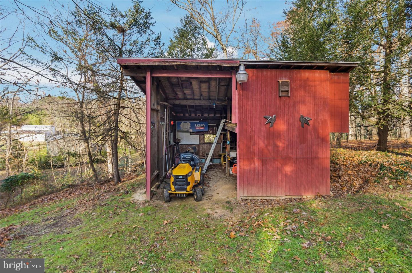 14629 Hanover Pike Upperco, MD 21155 - Photo 35 of 38 a view of a wooden house with a yard and large tree