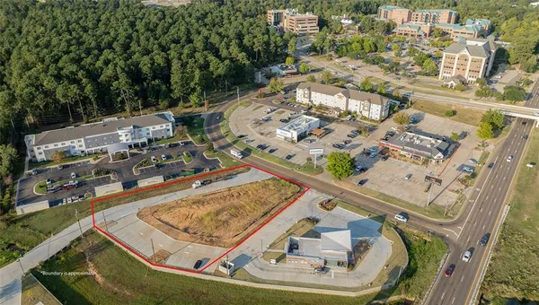 an aerial view of a house with a swimming pool
