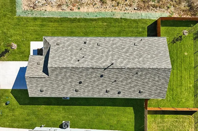 a view of a lake with a yard