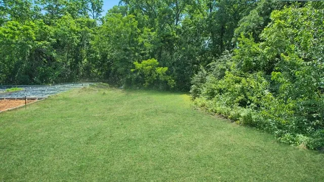 a view of a lake with a yard