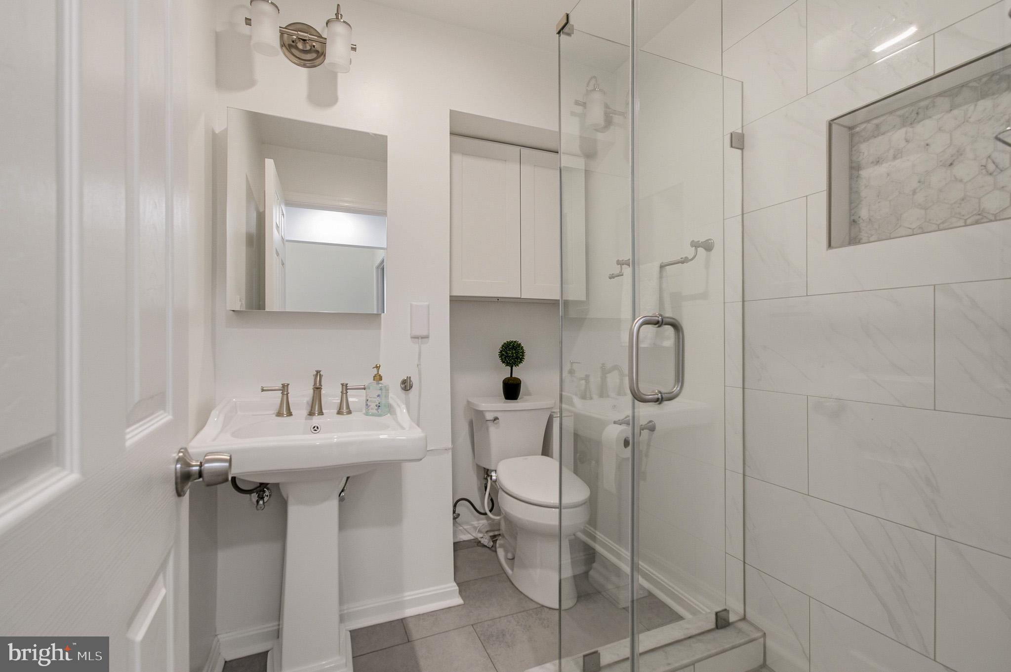 1016 Carrs Road Annapolis, MD 21403 - Photo 26 of 42 a bathroom with a sink toilet and shower