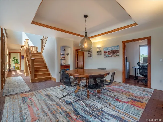 a view of a chairs and table in a room