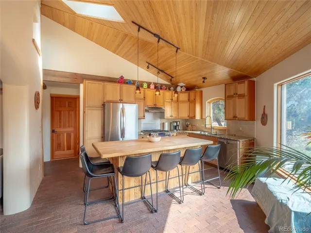 a kitchen with a table and chairs in it