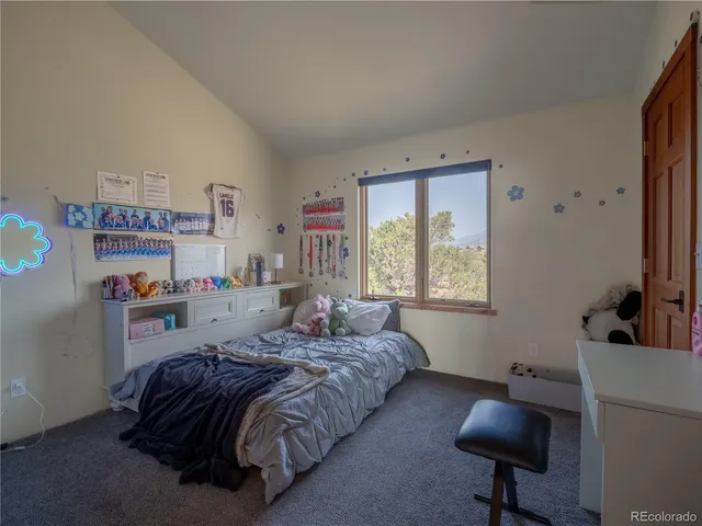 a bedroom with a bed furniture and a window