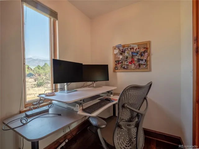 a view of a workspace with furniture
