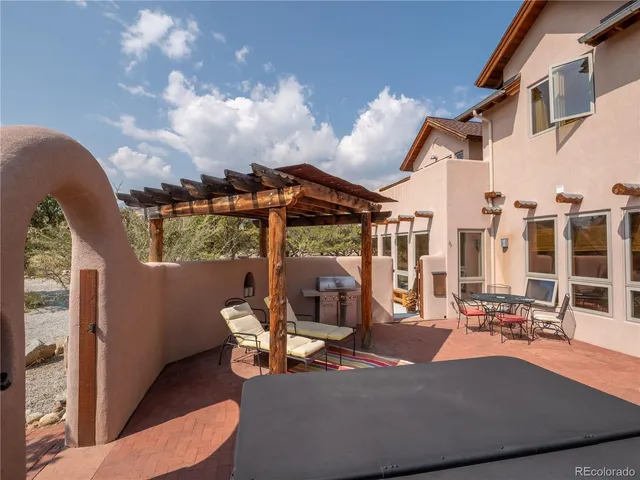 a view of a patio with couches and potted plants