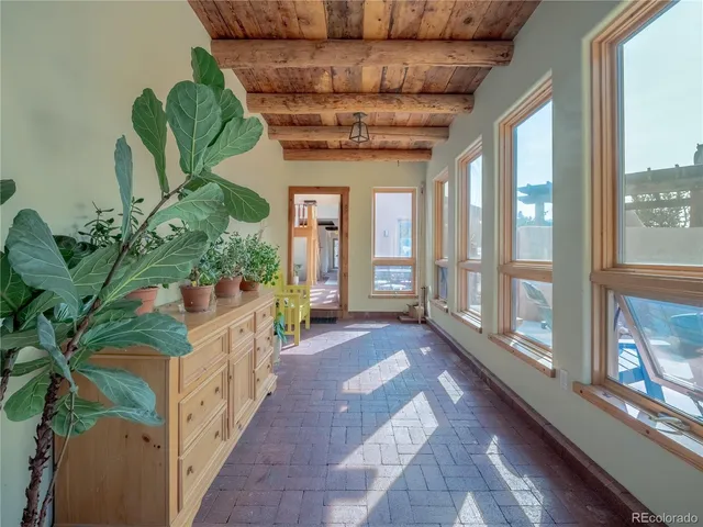 a lobby with furniture and a potted plant
