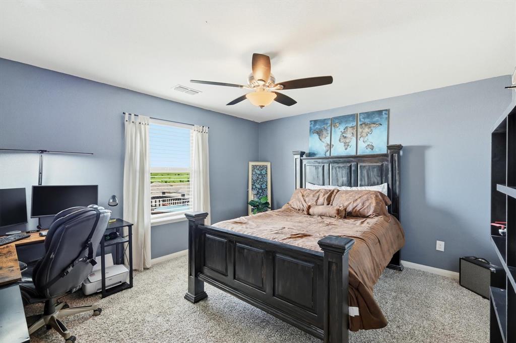 189 Point Rider Road Newark, TX 76071 - Photo 10 of 14 a bedroom with a bed and a desk