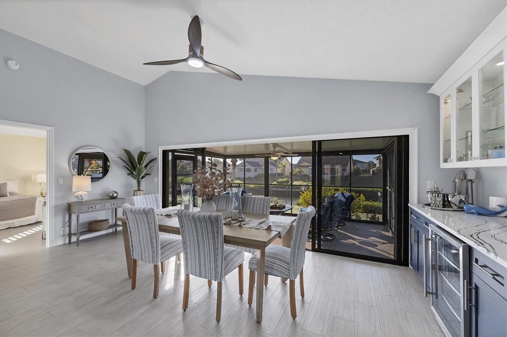 139 Inlets Boulevard, Unit 139 Nokomis, FL 34275 - Photo 13 of 59 a dining room with furniture and window