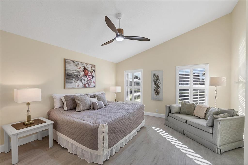 139 Inlets Boulevard, Unit 139 Nokomis, FL 34275 - Photo 14 of 59 a bedroom with a bed couch and window