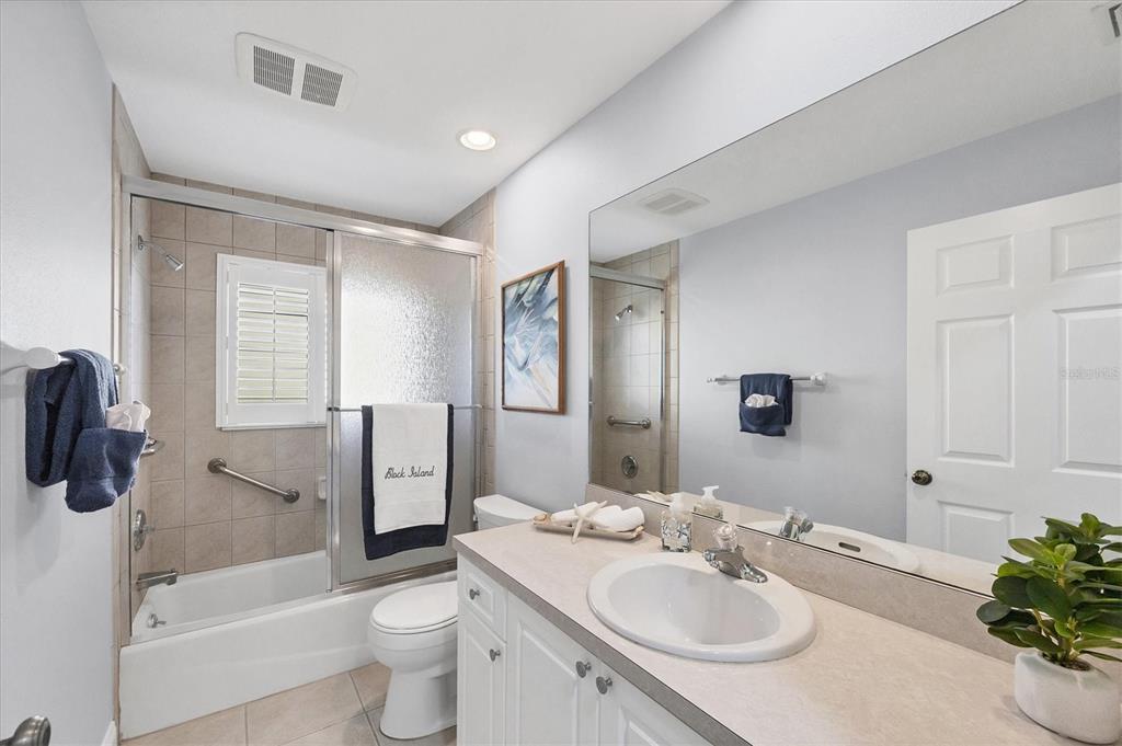 139 Inlets Boulevard, Unit 139 Nokomis, FL 34275 - Photo 19 of 59 a bathroom with a sink toilet tub and shower