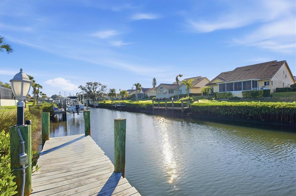 139 Inlets Boulevard, Unit 139 Nokomis, FL 34275 - Photo 23 of 59 a view of a lake with a terrace