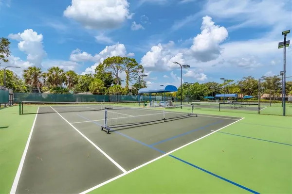 a view of a swimming pool with an outdoor space and seating