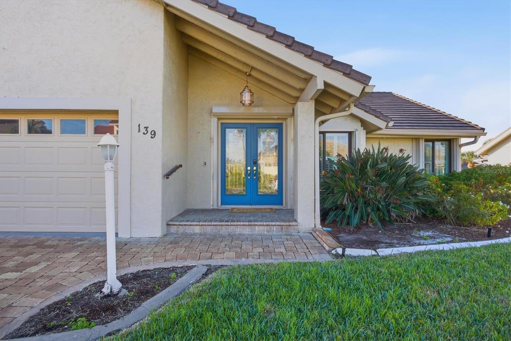 139 Inlets Boulevard, Unit 139 Nokomis, FL 34275 - Photo 4 of 59 a view of front a house with a yard