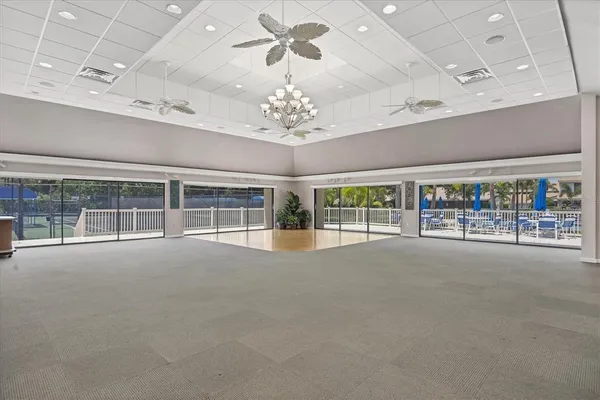 an aerial view of residential houses with outdoor space and lake view