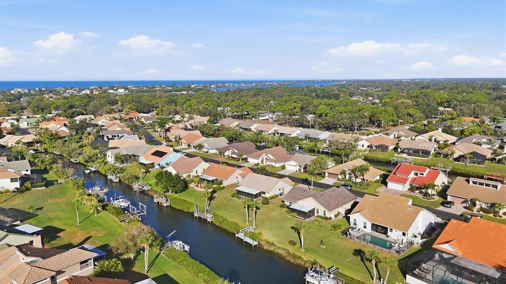 139 Inlets Boulevard, Unit 139 Nokomis, FL 34275 - Photo 50 of 59 an aerial view of residential houses with outdoor space and trees