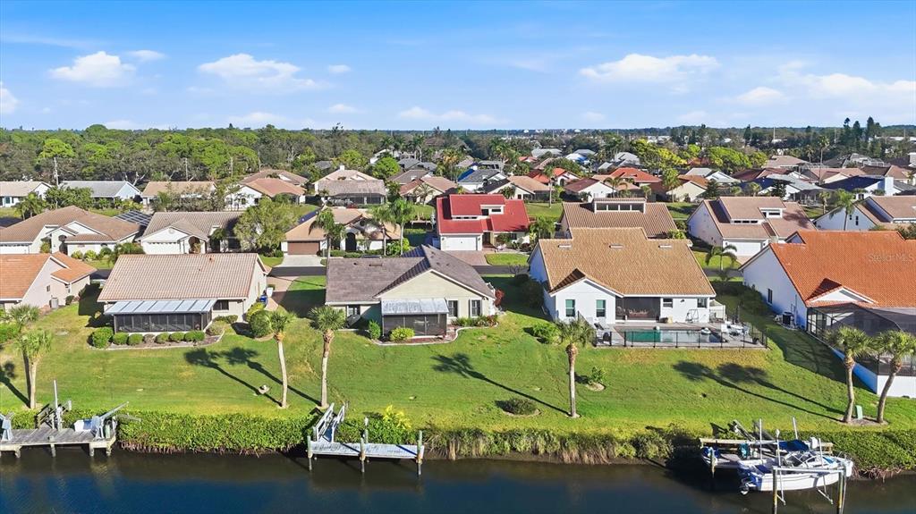 139 Inlets Boulevard, Unit 139 Nokomis, FL 34275 - Photo 51 of 59 an aerial view of residential houses with outdoor space and lake view