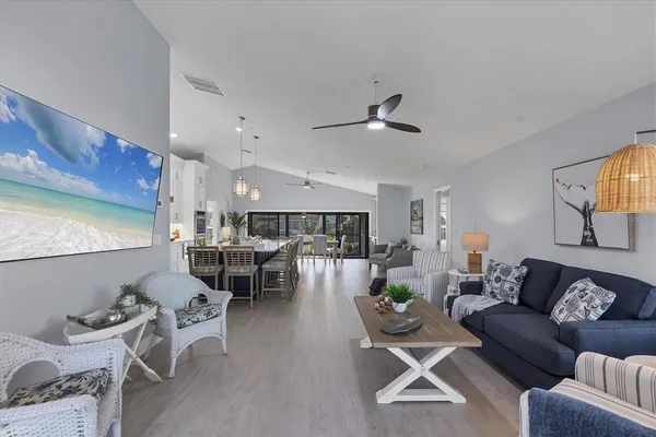 a large kitchen with a table and chairs