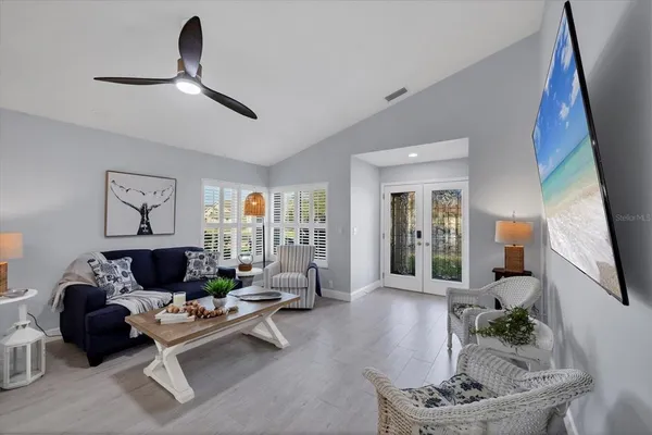 a large kitchen with a table and chairs