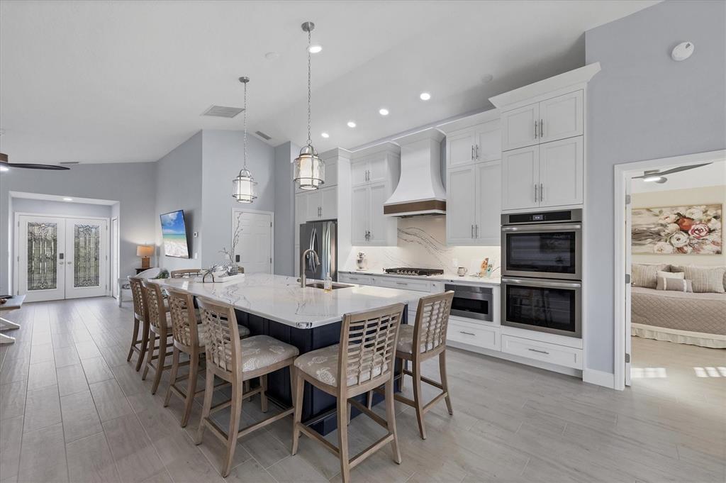 139 Inlets Boulevard, Unit 139 Nokomis, FL 34275 - Photo 8 of 59 a large kitchen with a table and chairs