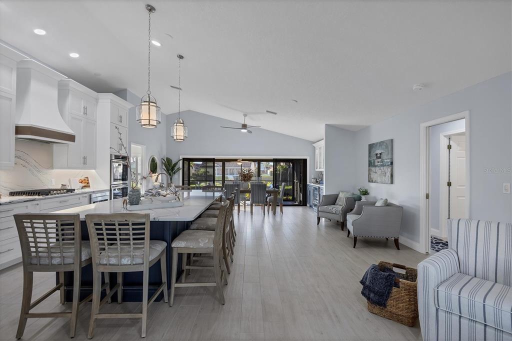 139 Inlets Boulevard, Unit 139 Nokomis, FL 34275 - Photo 9 of 59 a large kitchen with a table and chairs