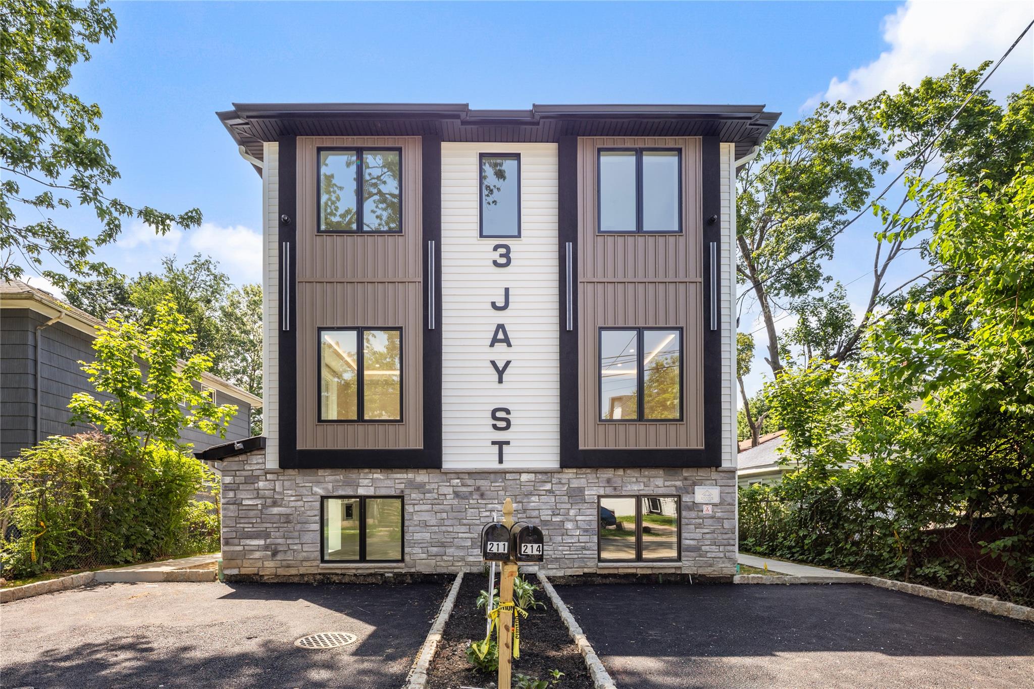 3 Jay Street, Unit 214 Spring Valley, NY 10977 - Photo 1 of 1 a front view of a house
