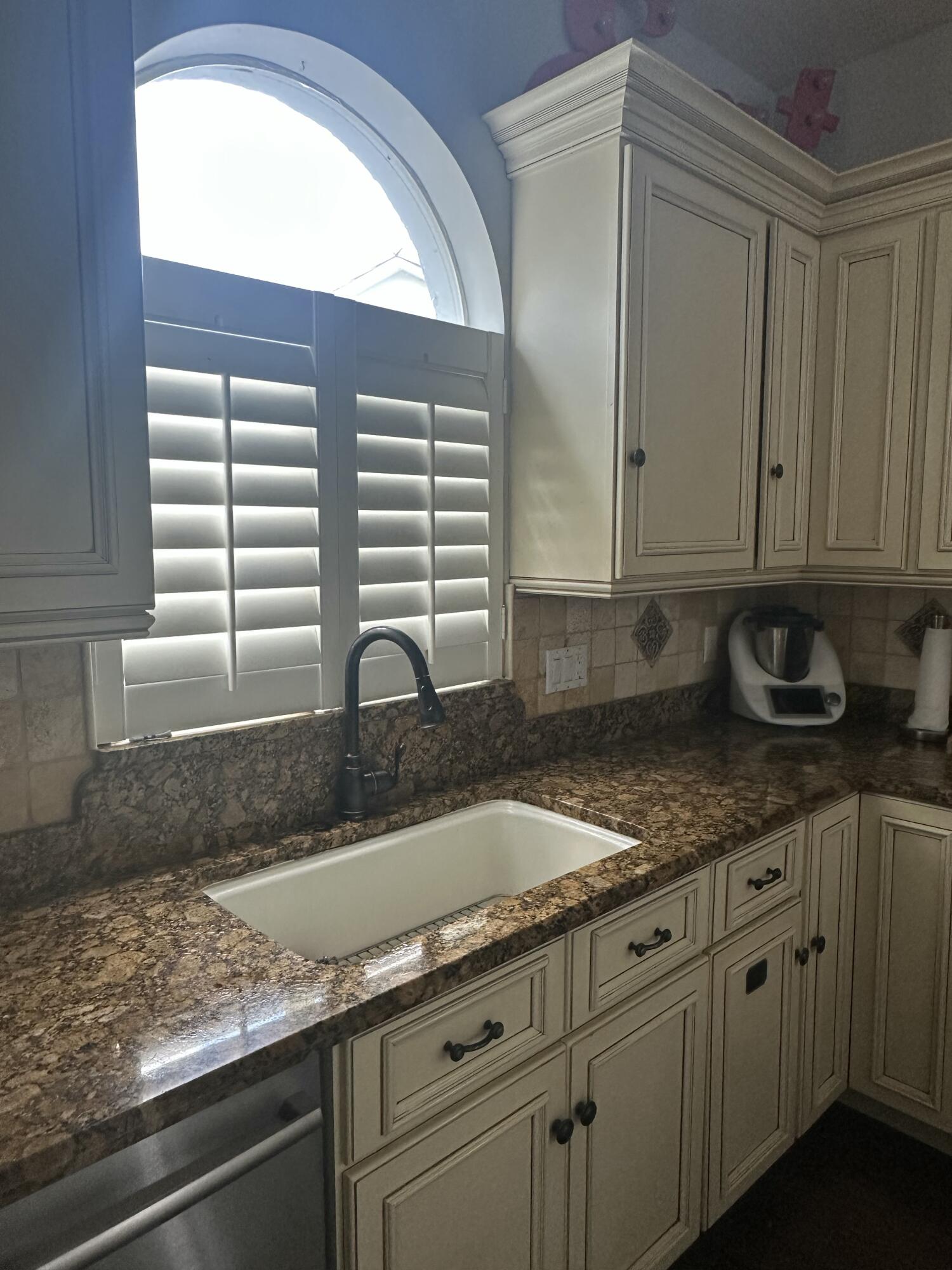 115 Spoonbill Court Jupiter, FL 33458 - Photo 11 of 52 a kitchen with granite countertop white cabinets and a sink