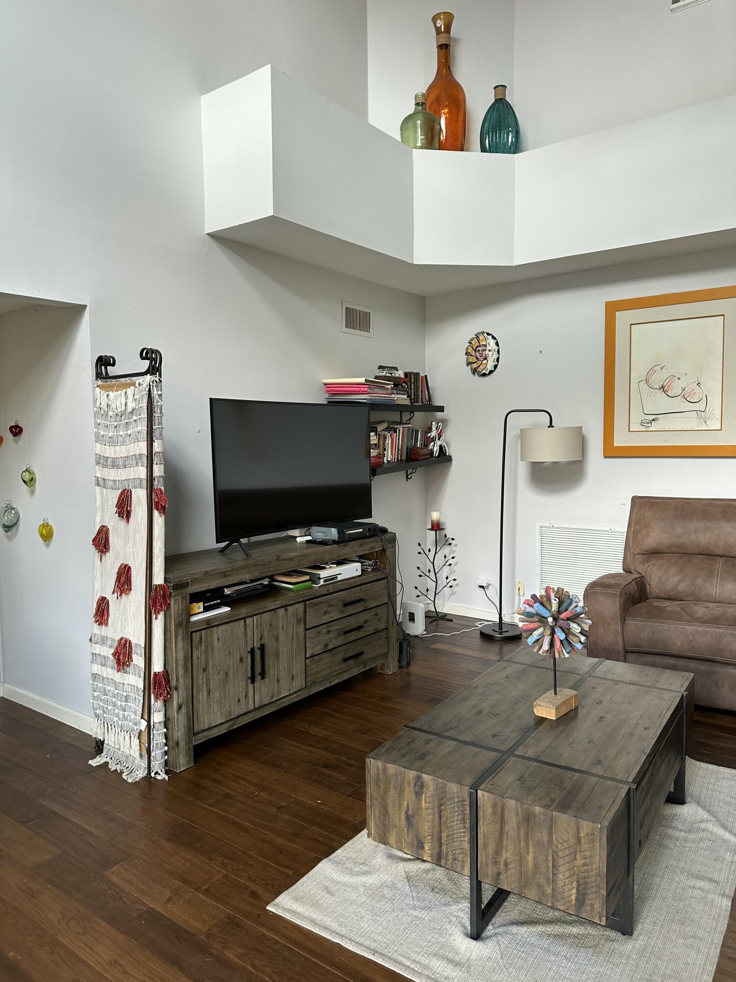 115 Spoonbill Court Jupiter, FL 33458 - Photo 19 of 52 a living room with furniture and a flat screen tv