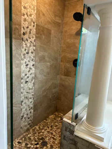 a bathroom with a bathtub and window