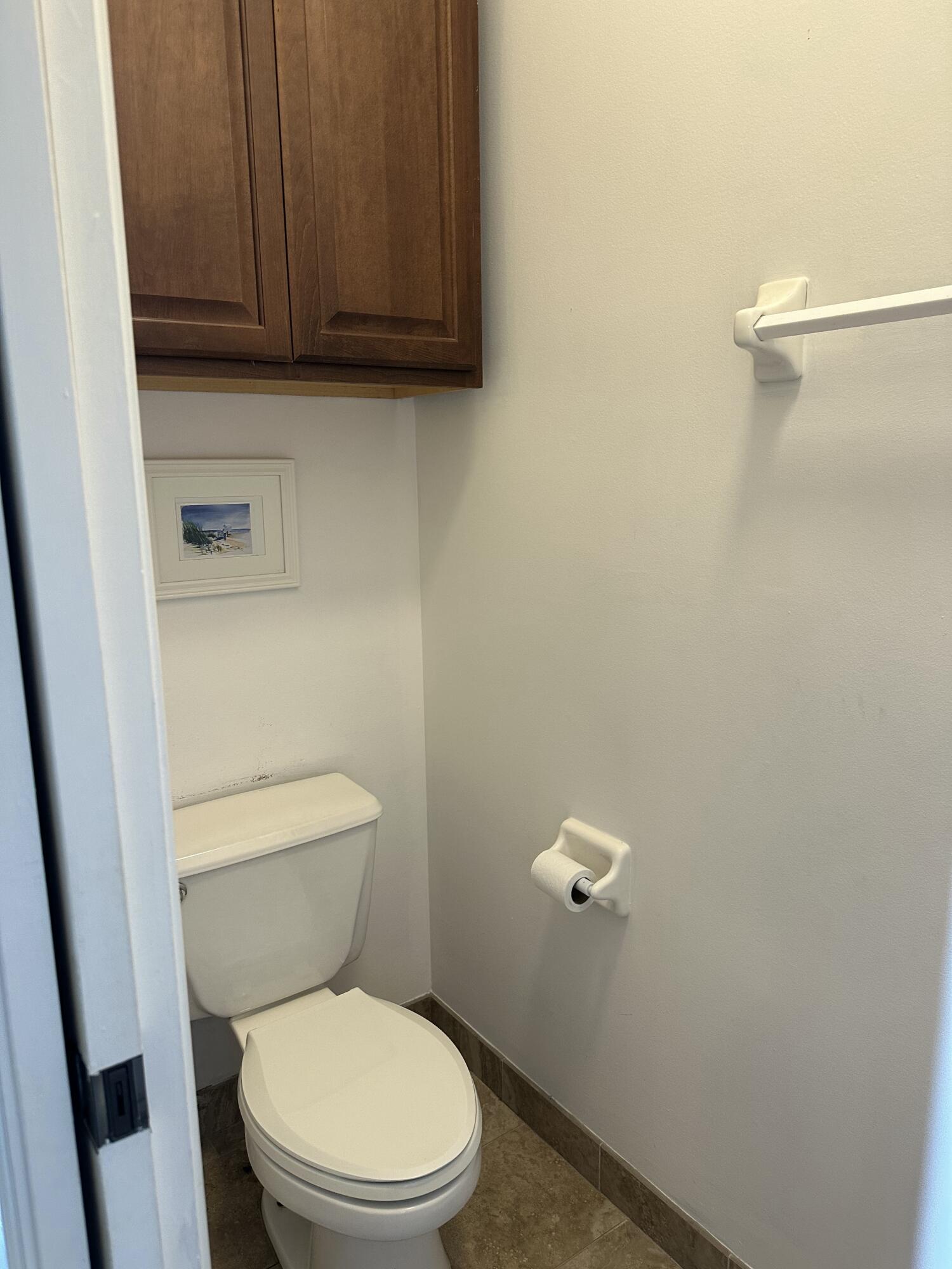 115 Spoonbill Court Jupiter, FL 33458 - Photo 28 of 52 a white toilet sitting next to a shower