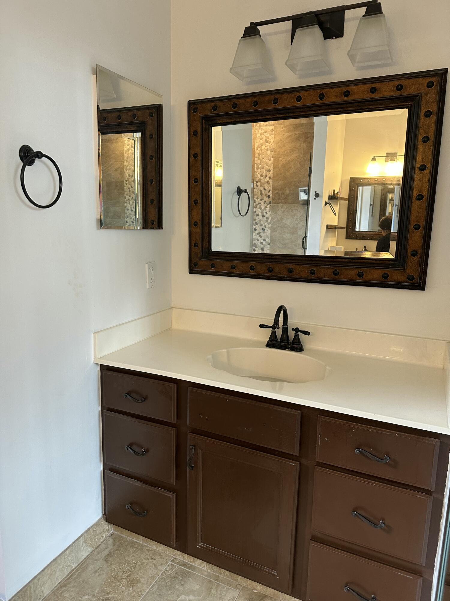 115 Spoonbill Court Jupiter, FL 33458 - Photo 29 of 52 a view of double vanity sink with mirror