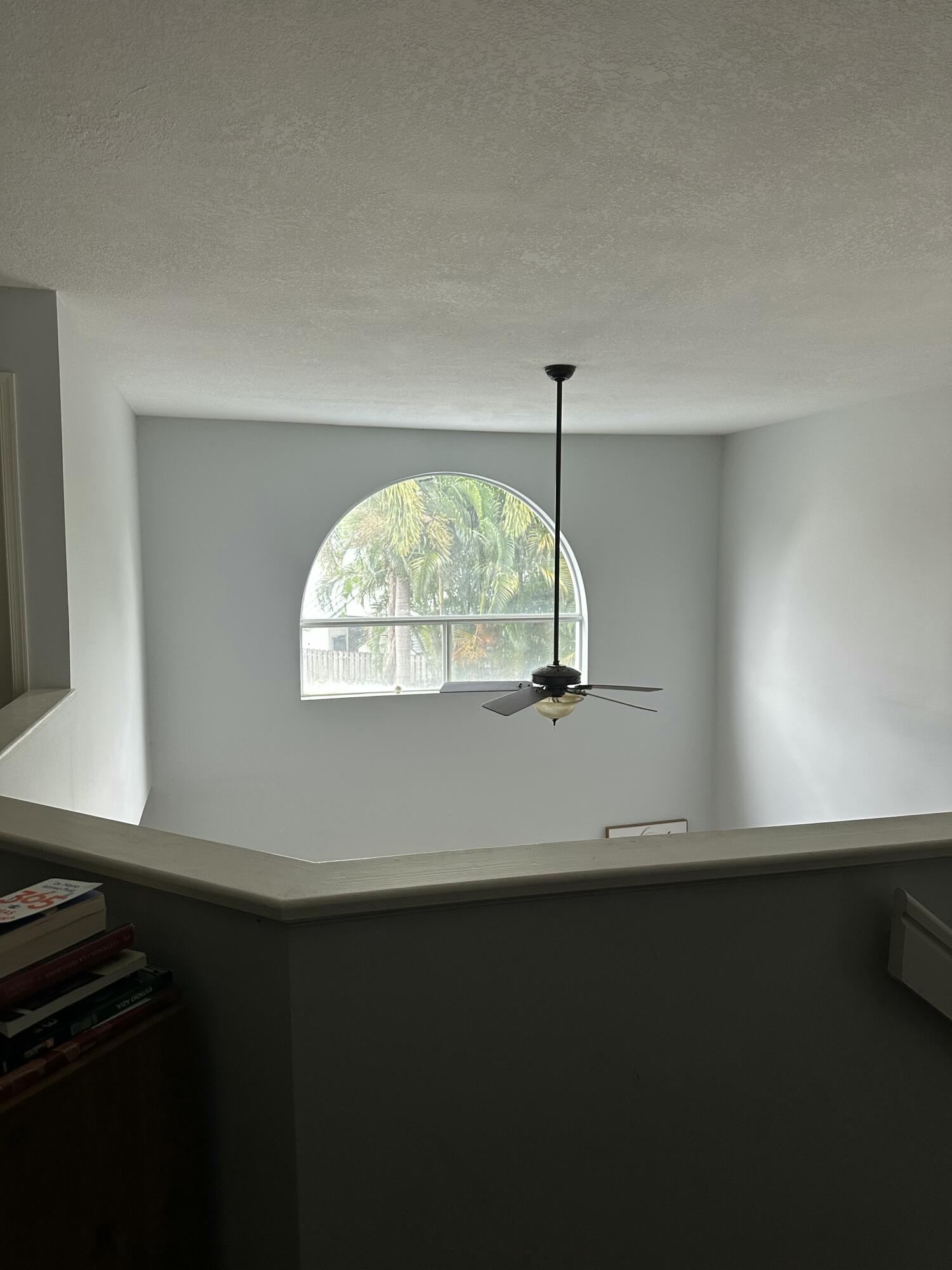 115 Spoonbill Court Jupiter, FL 33458 - Photo 32 of 52 a view of an empty room with a window