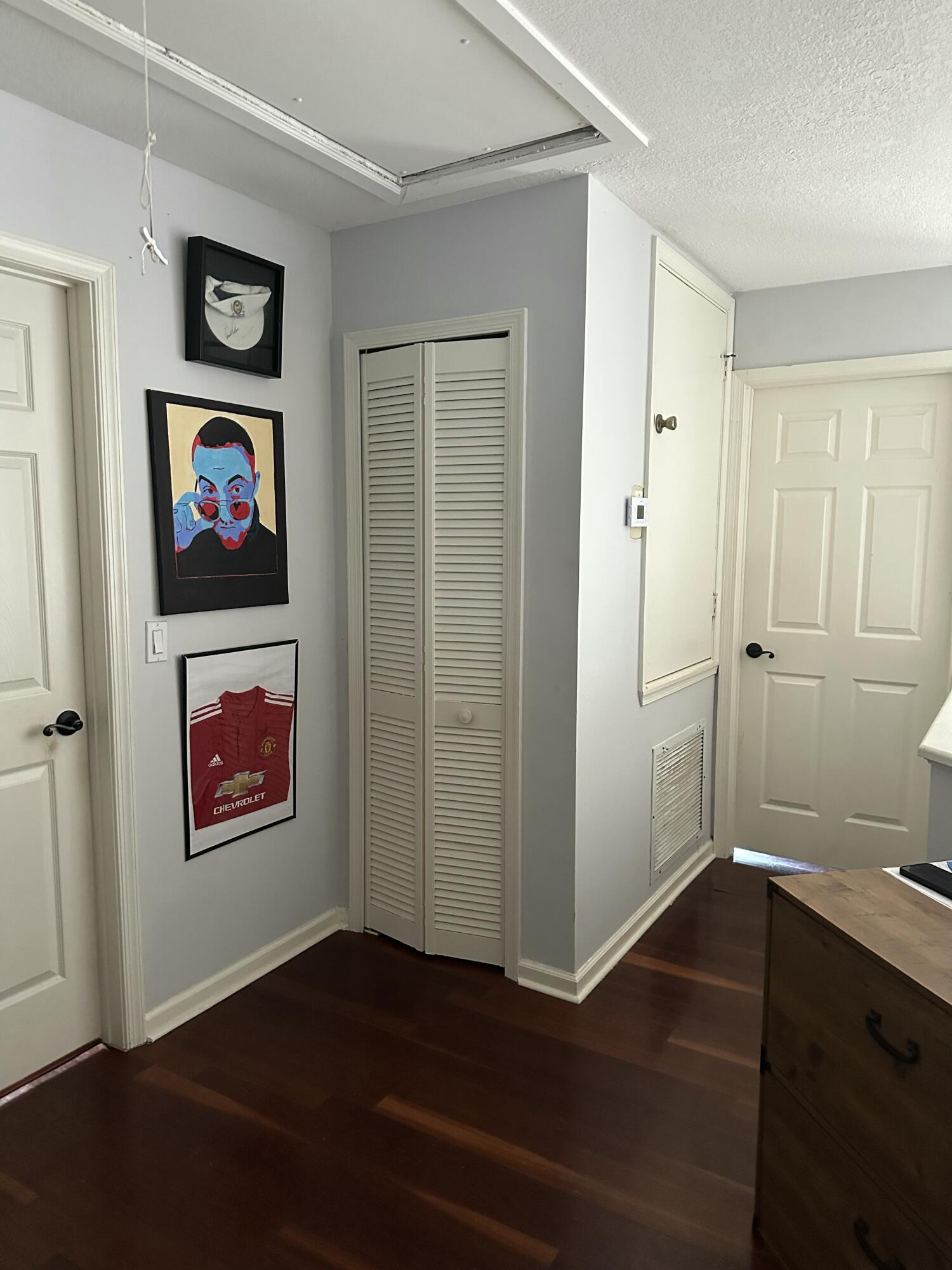 115 Spoonbill Court Jupiter, FL 33458 - Photo 33 of 52 an empty room with wooden floor and closet