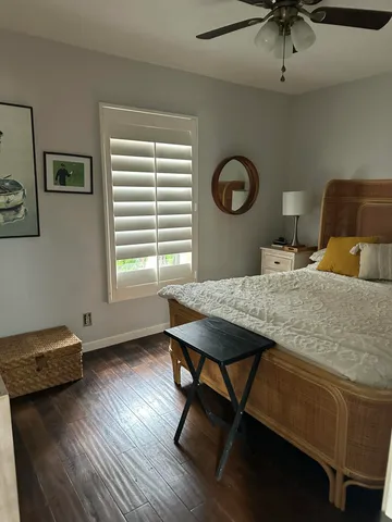 a view of living room filled with furniture and plants