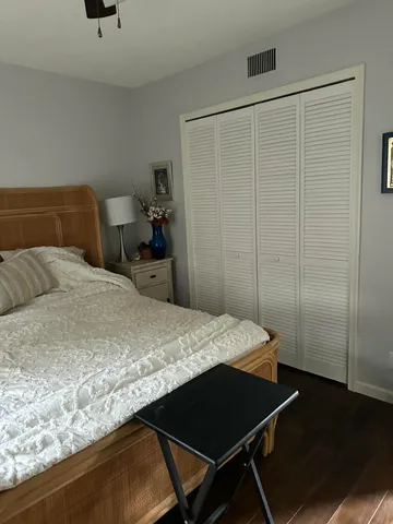 a living room filled with furniture and a floor to ceiling window