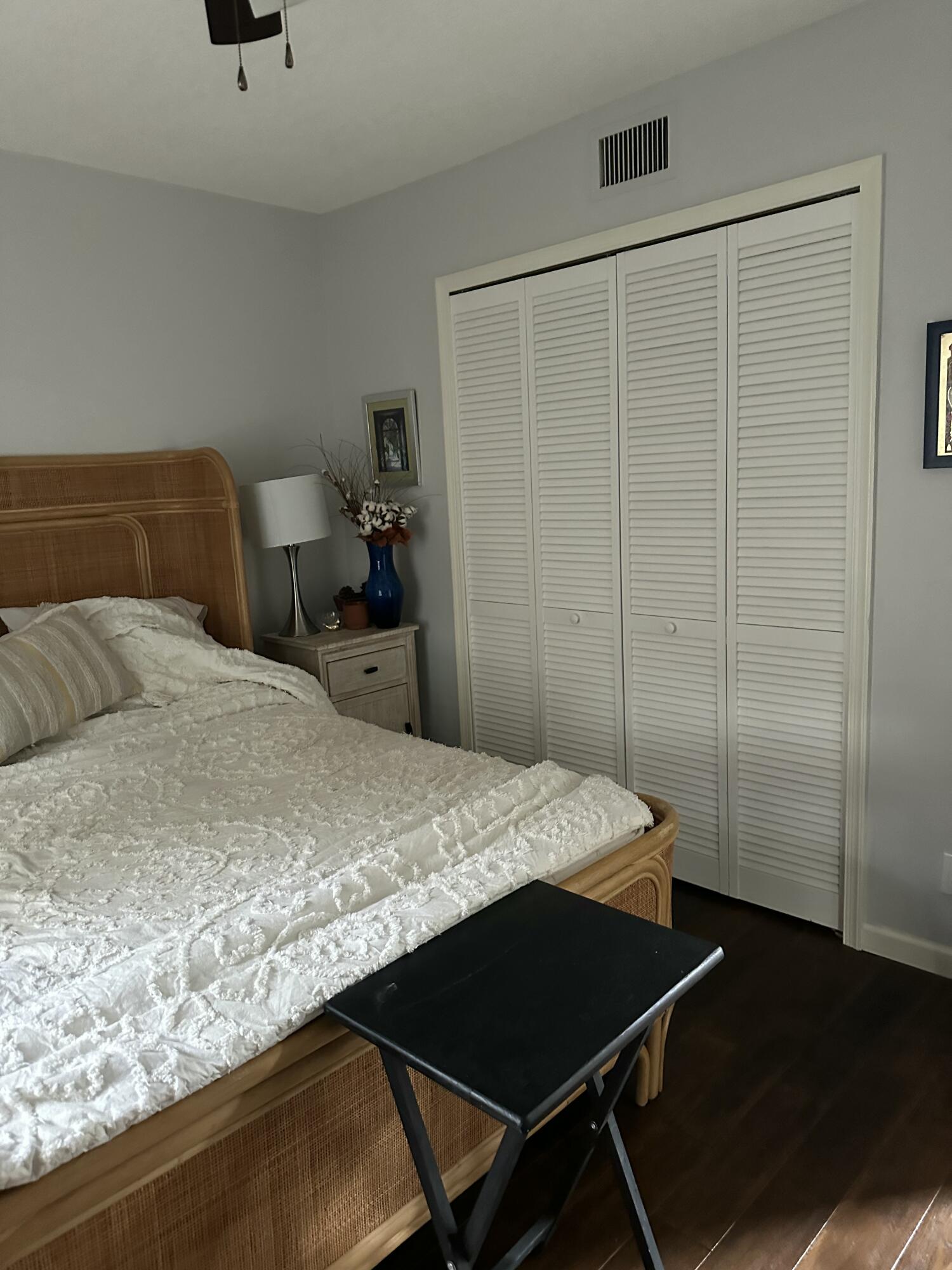 115 Spoonbill Court Jupiter, FL 33458 - Photo 43 of 52 a bedroom with a bed and dresser