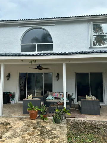 a view of a swimming pool with a patio
