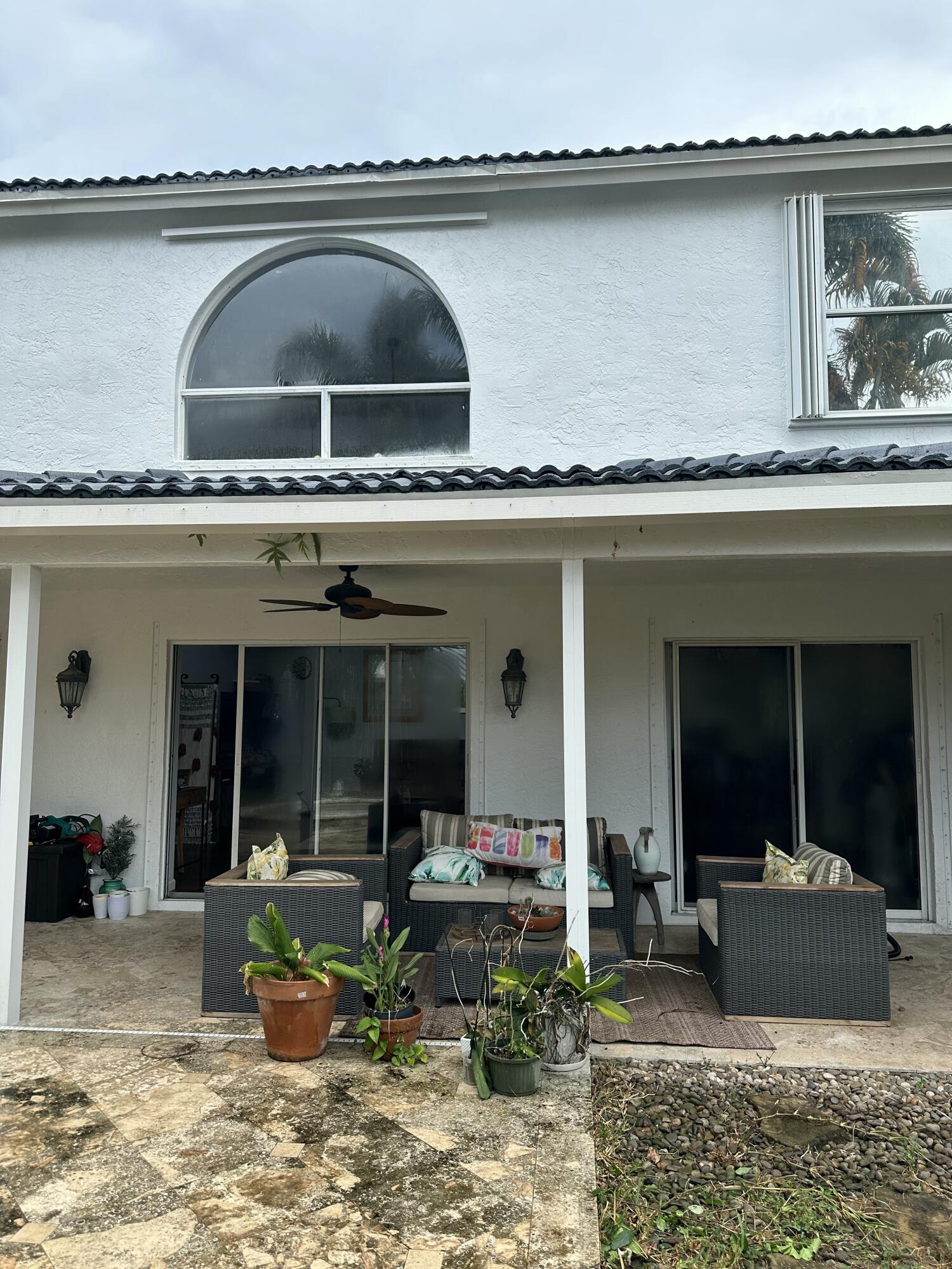 115 Spoonbill Court Jupiter, FL 33458 - Photo 44 of 52 a view of living room filled with furniture and plants