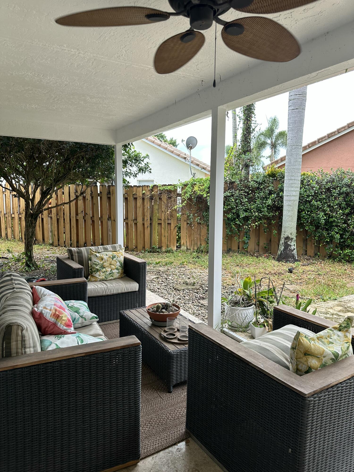 115 Spoonbill Court Jupiter, FL 33458 - Photo 45 of 52 a living room filled with furniture and a floor to ceiling window