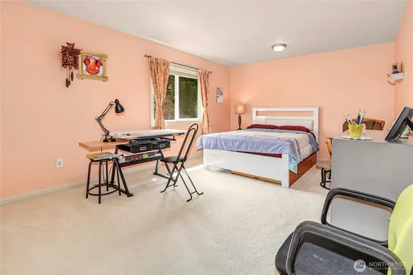 a bedroom with furniture and a window