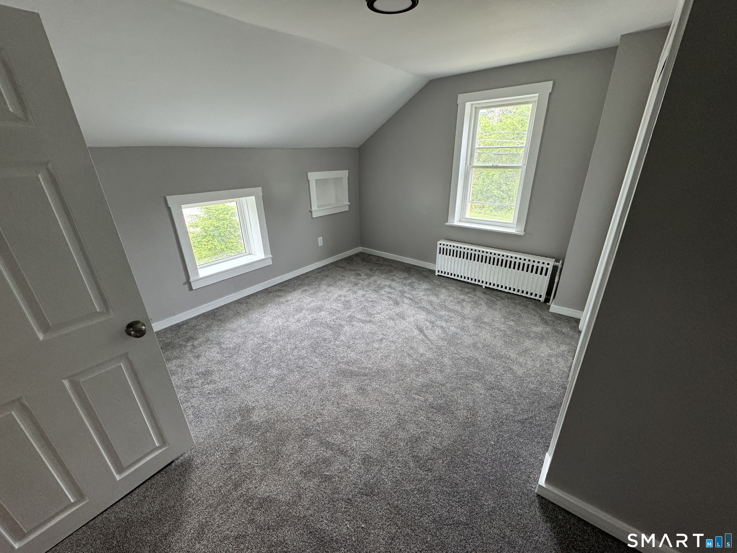 10 Center Street Windsor Locks, CT 06096 - Photo 8 of 25 an empty room with windows