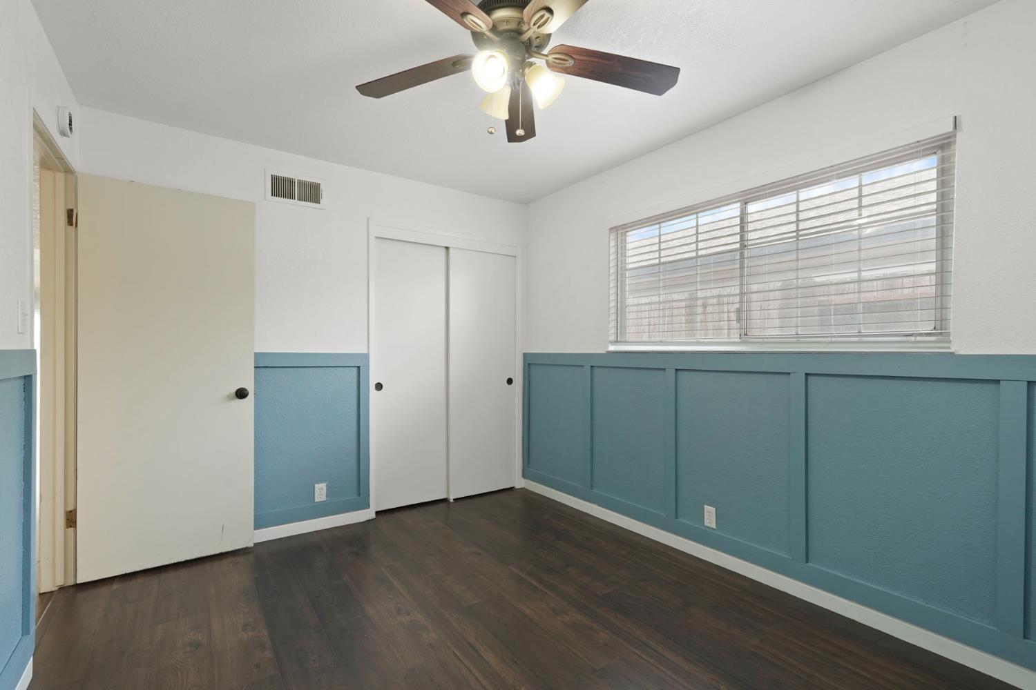 1525 West Vine Street Lodi, CA 95242 - Photo 25 of 36 a view of an empty room with a window and a ceiling fan