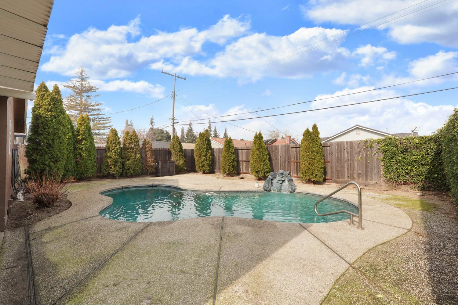 1525 West Vine Street Lodi, CA 95242 - Photo 30 of 36 a view of a garden with a fountain