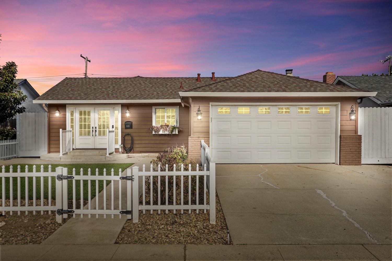 1525 West Vine Street Lodi, CA 95242 - Photo 3 of 36 a front view of a house with a yard