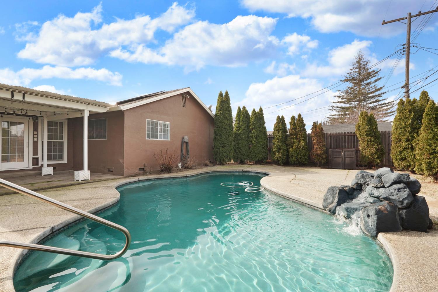 1525 West Vine Street Lodi, CA 95242 - Photo 35 of 36 a view of a house with backyard and a sitting area