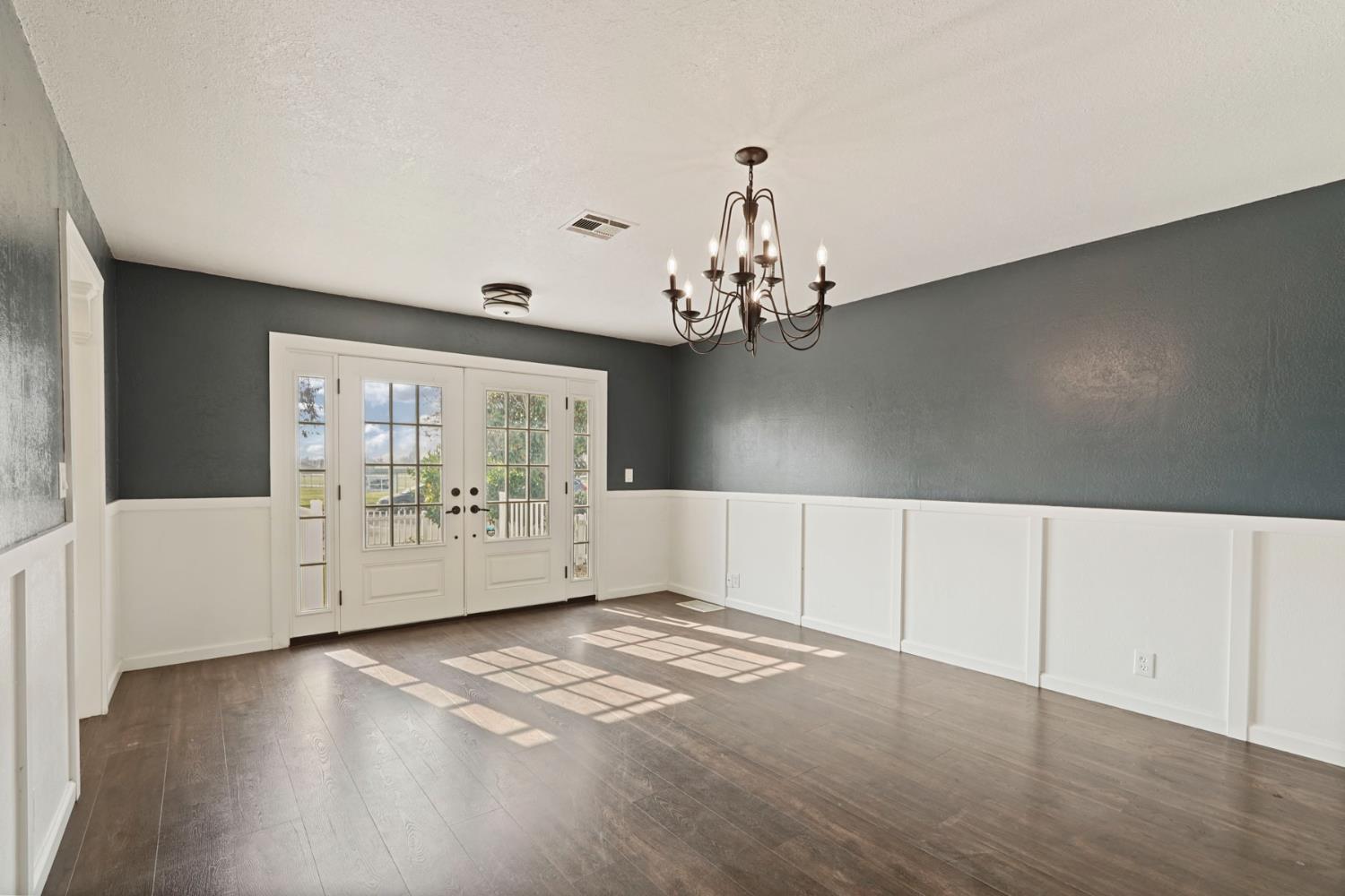 1525 West Vine Street Lodi, CA 95242 - Photo 9 of 36 a view of an empty room with a window