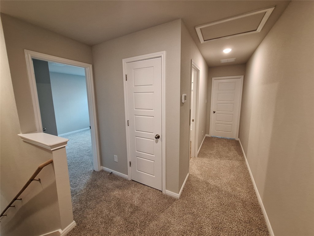 104 Gunner Road, Unit B Buda, TX 78610 - Photo 15 of 22 a view of a hallway with closet and wooden floor