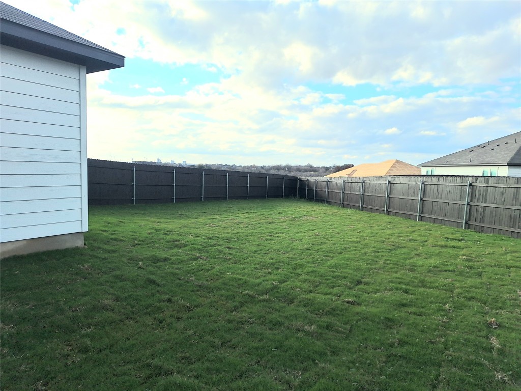 104 Gunner Road, Unit B Buda, TX 78610 - Photo 21 of 22 a view of a backyard