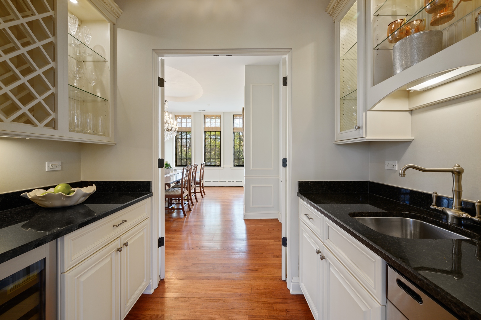 1435 Tower Road Winnetka, IL 60093 - Photo 12 of 34 a kitchen with granite countertop a sink and cabinets