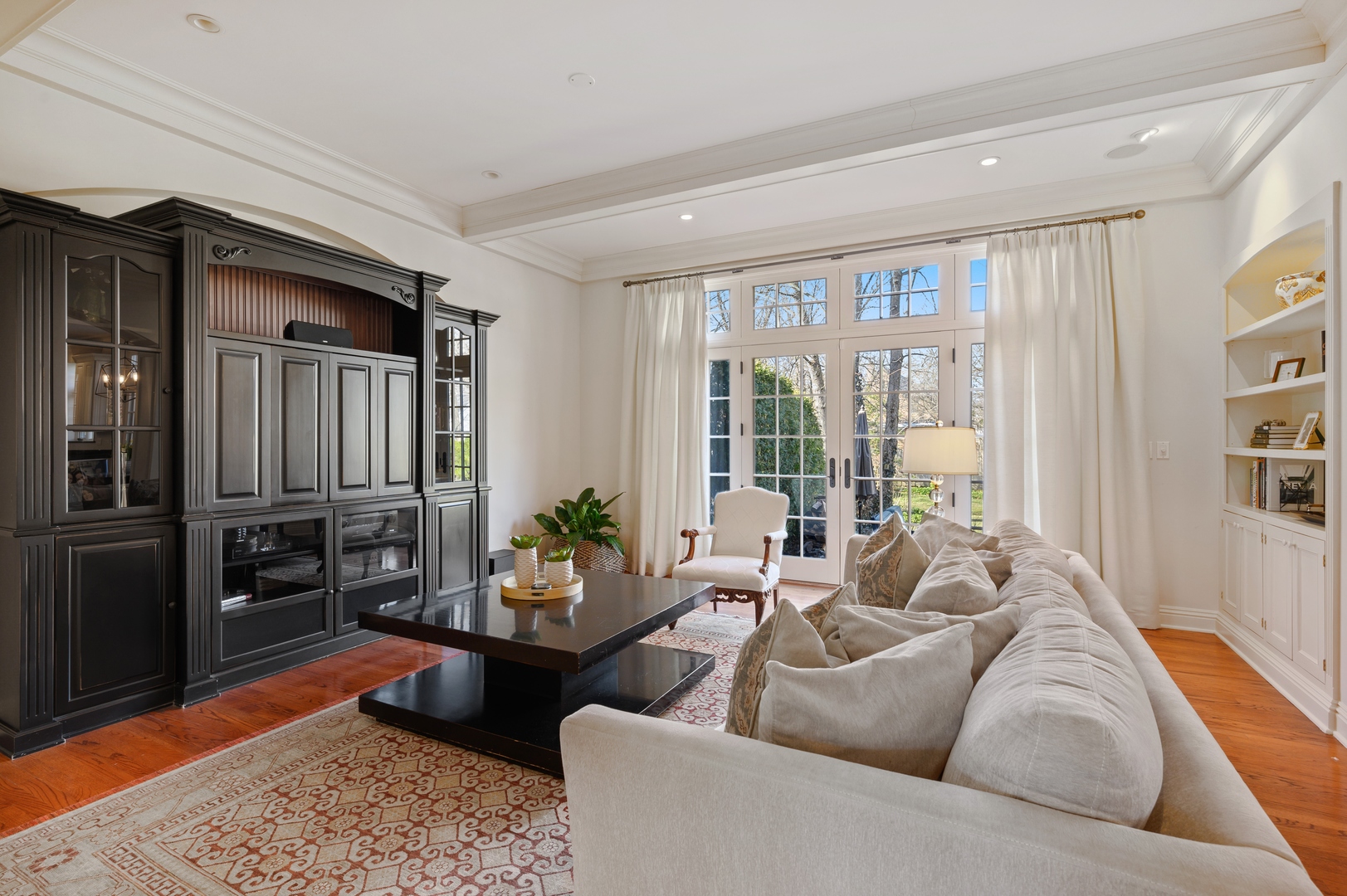 1435 Tower Road Winnetka, IL 60093 - Photo 18 of 34 a living room with furniture fireplace and a table